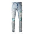 Jeans maschili blu chiaro con effetto usurato e patch, stile wash water worn, marca Valstrend shop.