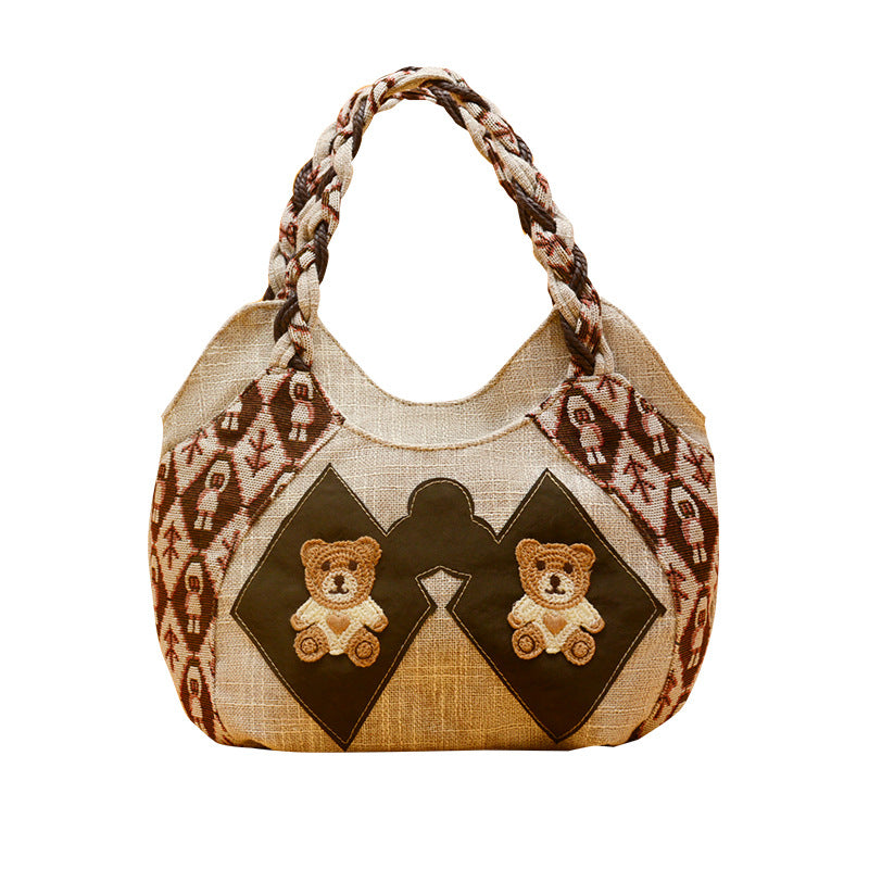 Borsa a tracolla vintage artistica Valstrend, piccola e casual, in tessuto con dettagli colorati e tracolla regolabile.