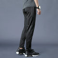 Pantaloni casual, a gamba dritta e larga, in tessuto morbido, marca Valstrend, ideali per allenamento e uso quotidiano.
