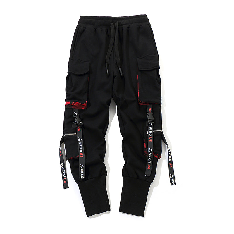 Pantaloni hip hop neri di Valstrend shop con dettagli in tessuto, stile urbano e vestibilità comoda, visibili nell'immagine.