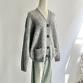 Cappotto in lana a maniche lunghe e spesse per donna, maglione lavorato a maglia, color crema, vestibilità comoda, stile invernale.