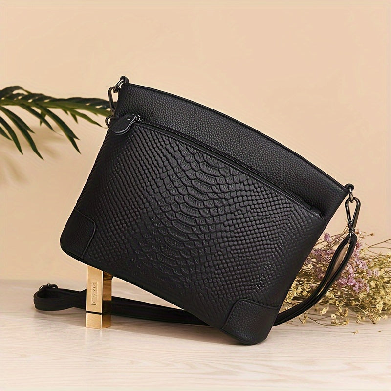 Borsa a tracolla in vera pelle con motivo coccodrillo, chiusura con zip, tracolla rimovibile e interno foderato in poliestere.