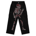 Jeans gothic con stampa e strass Valstrend, dettagli decorativi in tessuto denim con ricami e cristalli luccicanti.