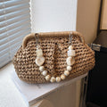 Borsa femminile in vimini intrecciato di Valstrend, versatile e elegante con dettagli in tessuto naturale.