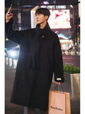 Cappotto di lana da uomo lungo medio in stile britannico autunno-inverno, veste elegante e calda, con dettagli classici.