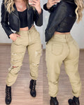 Salopette donna Valstrend con vita alta, strappi, orli alle caviglie e lacci, stile casual e comodo.