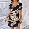 Vestito elegante con stampa piume europea e americana, marchio Valstrend, tessuto fluido e design sofisticato.