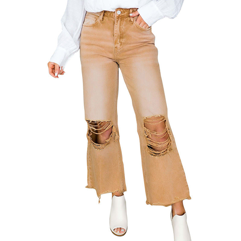 Jeans da donna strappati a vita alta in denim lavato, marca Valstrend shop, con dettagli di rottura e finitura sbiadita.
