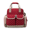 Donna in gravidanza con borsa multifunzione per mamma e bambino Valstrend, con tasche e scomparti pratici per tutto il necessario.
