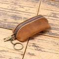 Portafoglio uomo in pelle Valstrend, clutch multi-funzionale con zip, tasche per monete e carte, elegante e pratico.