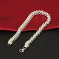 Bracciale intrecciato in acciaio inossidabile e titanio, gioiello elegante Valstrend con design raffinato e finitura lucida