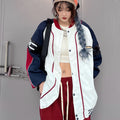 Giacca bomber americana Valstrend per uomo e donna, stile baseball con dettagli a contrasto e maniche a righe.