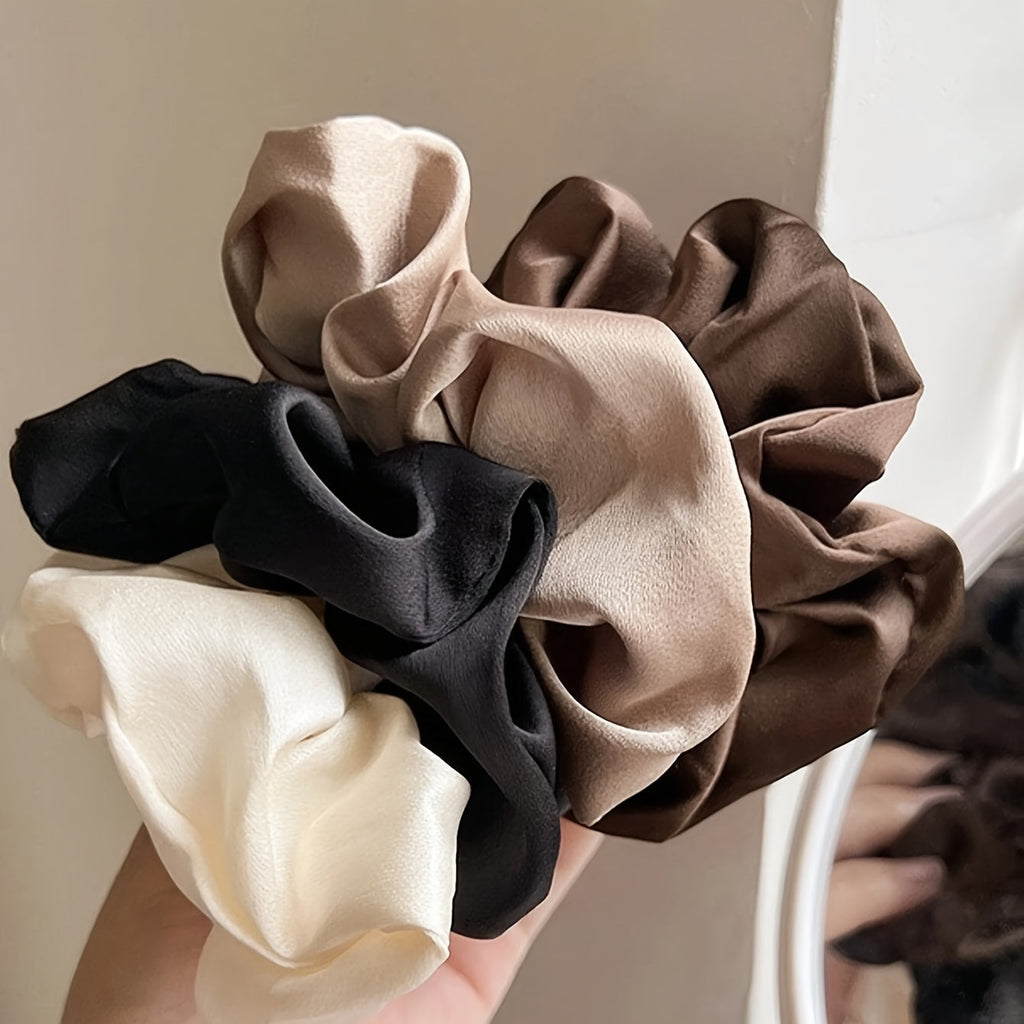 Set di 5 elastici per capelli Valstrend in nero, bianco e marrone, eleganti e versatili per tutte le età.