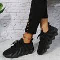 Scarpe sneaker unisex Valstrend con tomaia a maglia a forma di polpo, suola di gomma morbida e disponibile in taglie grandi.