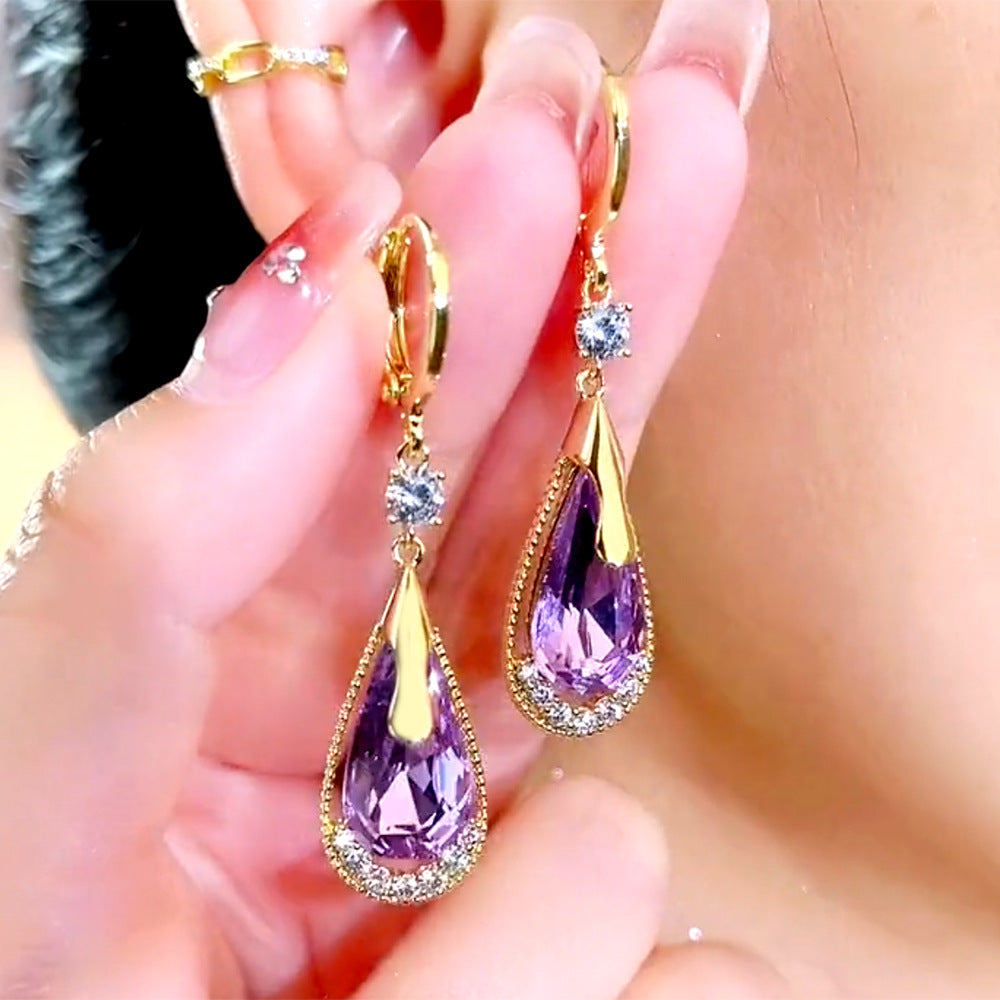 Orecchini a goccia in cristallo viola di alta qualità di Valstrend, design elegante e raffinato con pietre pendenti.