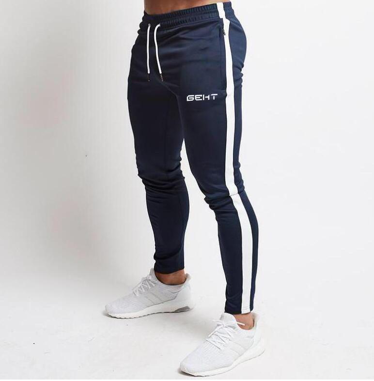 Pantaloni casual da palestra Valstrend, stile comodo e moderno, con elastico in vita e tasche frontali, in tessuto nero.