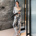 Completo di pigiami casual da uomo e donna Valstrend, morbido tessuto, design confortevole, con top e pantaloni coordinati.
