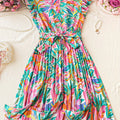 Vestito a linea A con stampa floreale tropicale, maniche ruchinate, spalla scoperta e gamba alta, ideale per primavera e estate.