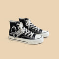 Scarpe casual in tela nera con graffiti Valstrend per studenti, dettagli in stile urbano e comodo design.
