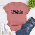 Maglietta La Bichota Karol G Valstrend, stile casual, stampa frontale, tessuto morbido, t-shirt bianca con design originale.