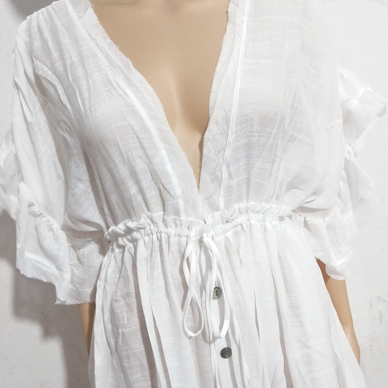 Vestito lungo da spiaggia in tessuto slub, con cintura e bottoni, protezione solare, marca Valstrend, in colore solido.