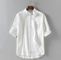 Camicia da uomo in lino Valstrend con colletto alto e vestibilità ampia, bianca e leggera, ideale per look estivi e casual.