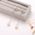 Orecchini pendenti in argento sterling con fiocco, perle e design ipollergenico, stile versatile e elegante, brand Valstrend.