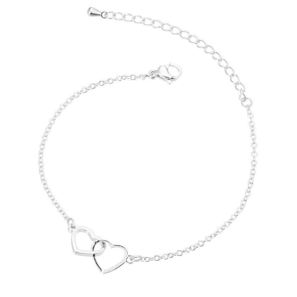 Bracciale trendy in argento sterling S925 con doppio cuore, stile moderno e raffinato, da indossare con ogni outfit.