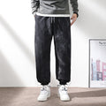 Pantaloni sportivi da uomo Valstrend con vita elastica, coulisse e lacci alla caviglia, tessuto morbido e comodo.