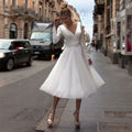 Abito da sposa corto da donna di sera Valstrend, vestito elegante con gonna corta e dettagli raffinati.