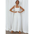 Giacca jumpsuit donna Valstrend, senza maniche, ampio a gamba larga, colore unito, schiena scoperta e stile casual.