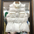 Blusa corta con allacciatura, vita alta e colletto a stand di Valstrend, in tessuto leggero e elegante.