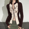 T-shirt a maniche lunghe Valstrend con stampa vintage di farfalle e dettagli di cucitura, con zip frontale.