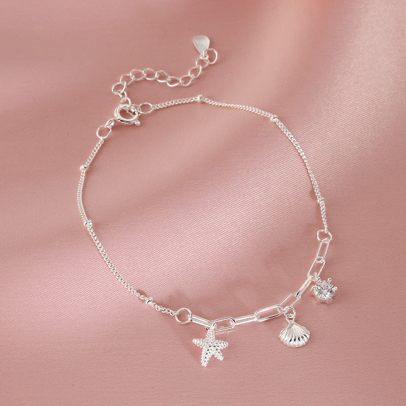 Bracciale femminile Valstrend con stelle marine e conchiglie stile seaside, accessorio fashion mare e spiaggia.