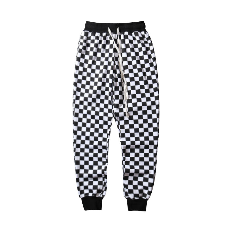Pantaloni a quadretti bianco e nero Valstrend Shop, stile classico a scacchi, con taglio comodo e tessuto morbido.