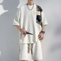 Completo casual con top corto e pantaloni larghi a manica corta, taglie comode, marchio Valstrend, vestibilità rilassata e moderna.