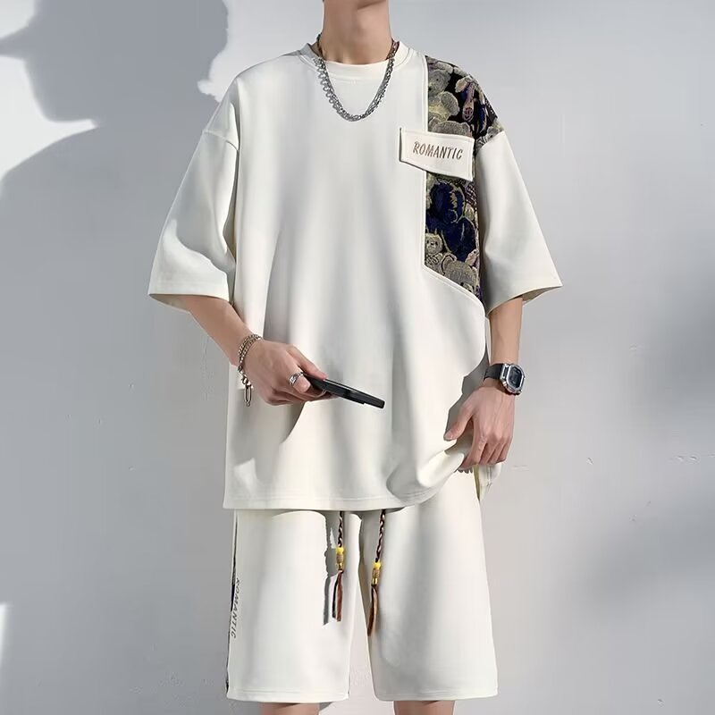 Completo casual con top corto e pantaloni larghi a manica corta, taglie comode, marchio Valstrend, vestibilità rilassata e moderna.