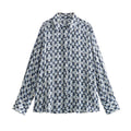 Camicia lunga in metallo e stampa Valstrend, maniche lunghe, tessuto leggero con dettagli di design metallico e stampa decorativa.