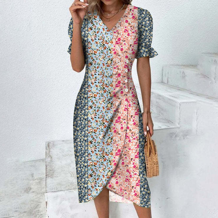 Vestito donna Valstrend con maniche a sbuffo, stampa collage e orlo irregolare, stile alla moda e femminile.
