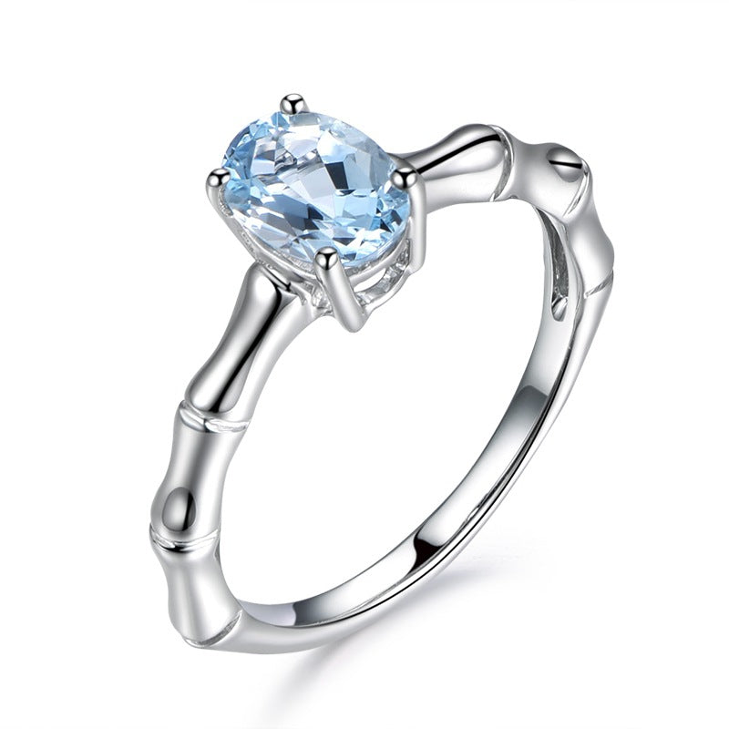 Anello femminile Zhen Rong in bamboo europeo e americano con pietra blu naturale, placcato oro 18K, design creativo.