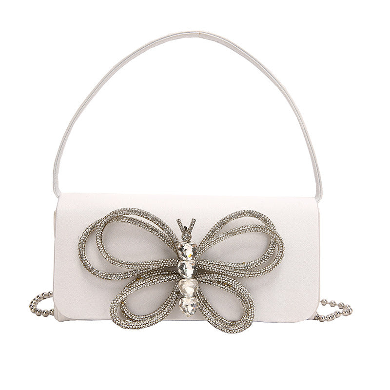 Borsa donna a fiocco Valstrend Shop, elegante con manico e dettagli decorativi, ideale per look femminili e sofisticati.
