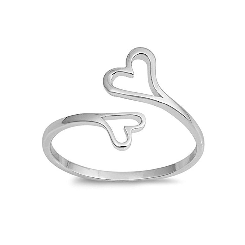 Anello regolabile Love Hearttex in titanio e acciaio inossidabile, uomo e donna, con cuore, per innamorati, in dettaglio fotografico.