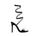 Sandali con tacco stiletto nero e oro da 11cm di Valstrend, punta rotonda, superficie in satin, decorati con strass e borchie.