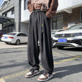 Pantaloni uomo retrò con cintura elastica larga, stile vintage, in tessuto morbido, marca Valstrend shop.