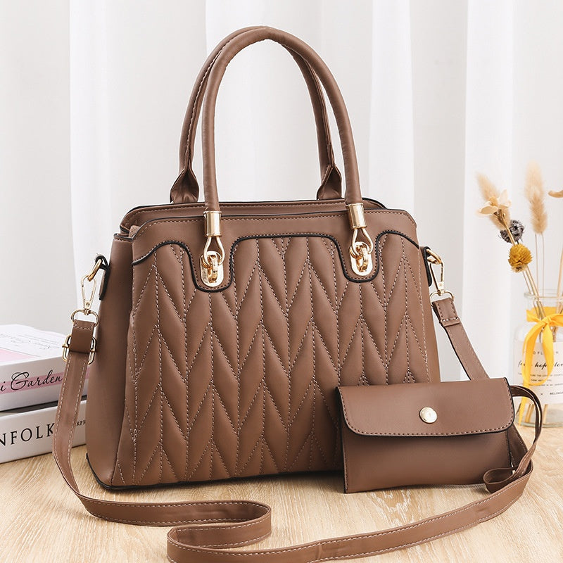 Borsa a mano Valstrend con motivo a diamante ricamato, spaziosa e alla moda, ideale per occasioni eleganti e quotidiane.