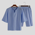 Pantaloni pigiama da uomo in cotone Valstrend, morbidi e comodi, con stampa a righe blu e bianco, visibili in primo piano.