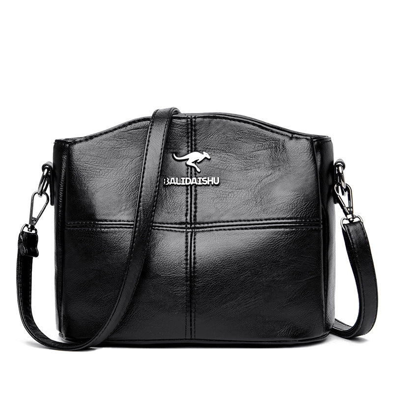 Borsa a tracolla patchwork Valstrend, spalla, in tessuto colorato con dettagli unici e tracolla regolabile.