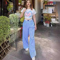 Pantaloni larghi a righe verticali con elastico in vita e dettaglio a due pezzi finti, marchio Valstrend shop.