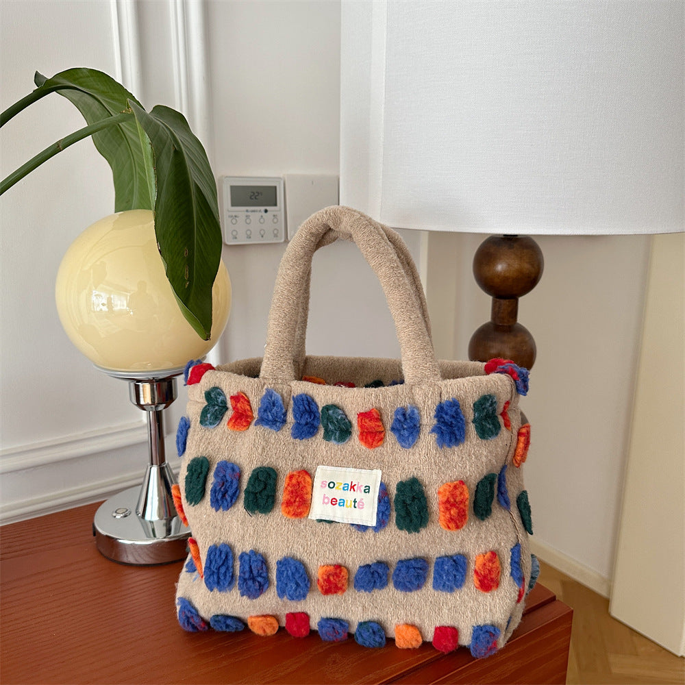 Borsa a tracolla in peluche Valstrend, spaziosa e portatile, con design a secchiello e manico a spalla, morbida e colorata.