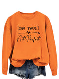Felpa oversize con lettere stampate "Be Real Not Perfect" di Valstrend, maniche lunghe e stile casual, morbida e comoda.